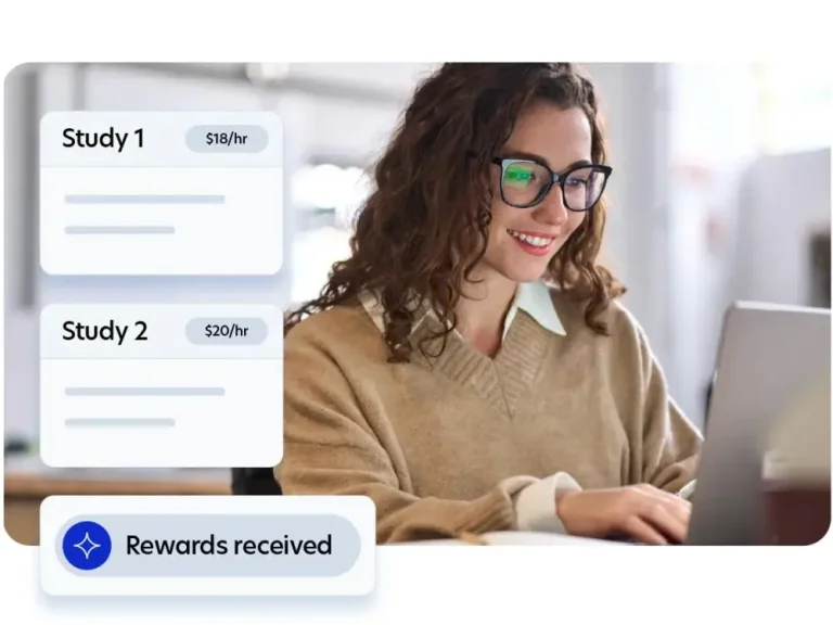A woman at a computer viewing available paid research studies with hourly rates on her Prolific study dashboard.